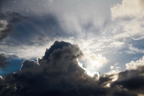 The sun buried in a storm anvil over the Caribbean