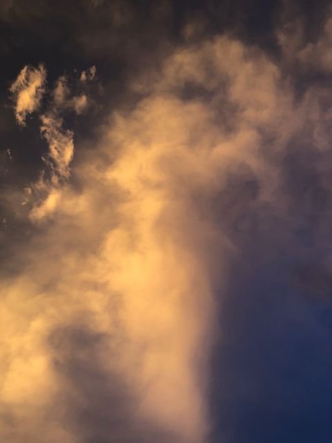 A thunderhead catching fire at sunset