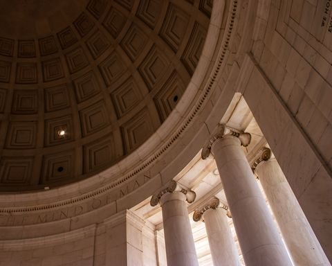 The coffered dome of the Jefferson Memorial, columns catching evening light