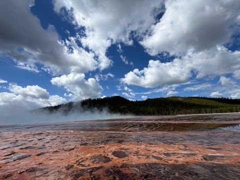 Clouds reflected in the thin water of a thermal flat